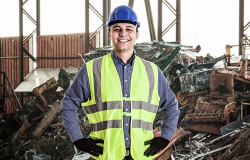 Workers sorting waste and recyclables during a clearance